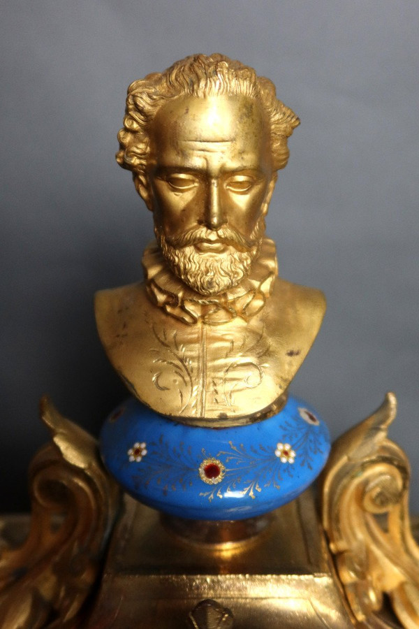 19th century clock with golden regula and colored enamelled earthenware