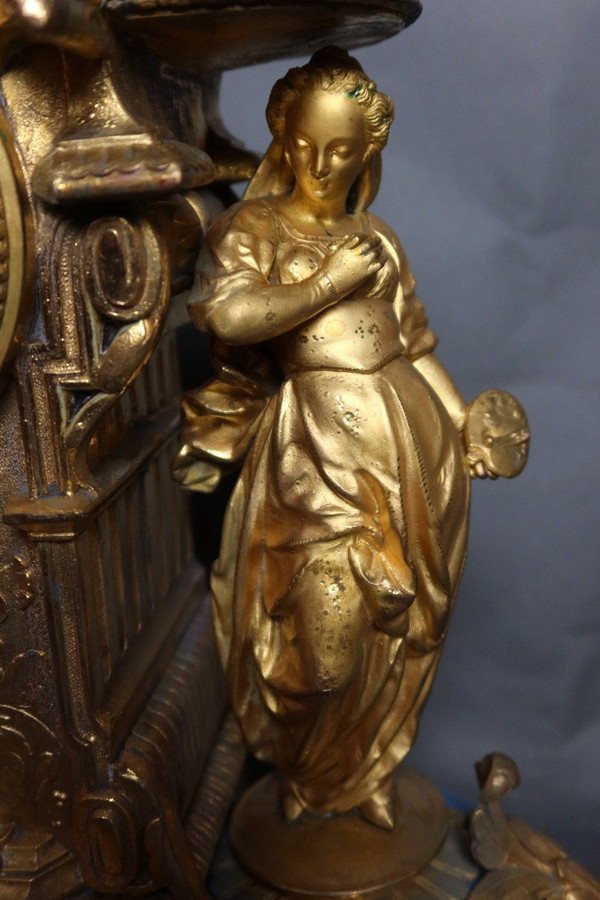 19th century clock with golden regula and colored enamelled earthenware