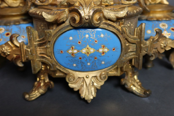 19th century clock with golden regula and colored enamelled earthenware