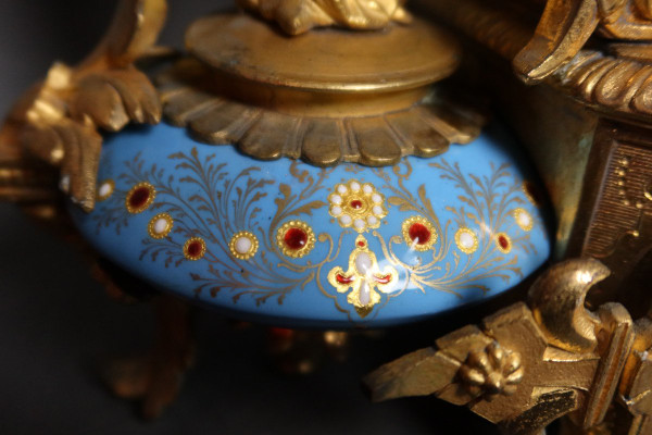 19th century clock with golden regula and colored enamelled earthenware