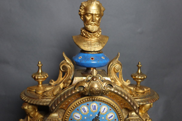 19th century clock with golden regula and colored enamelled earthenware