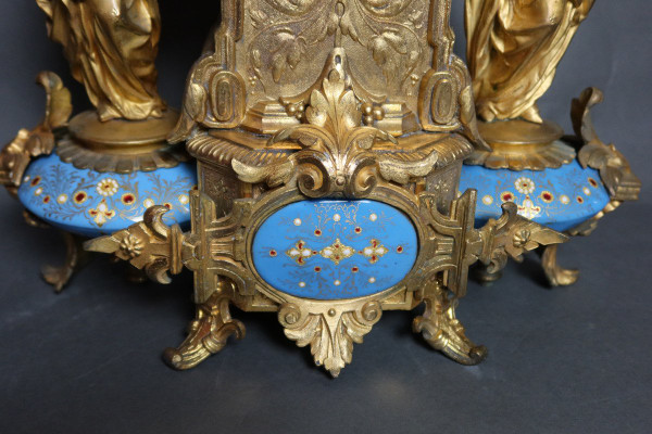 19th century clock with golden regula and colored enamelled earthenware