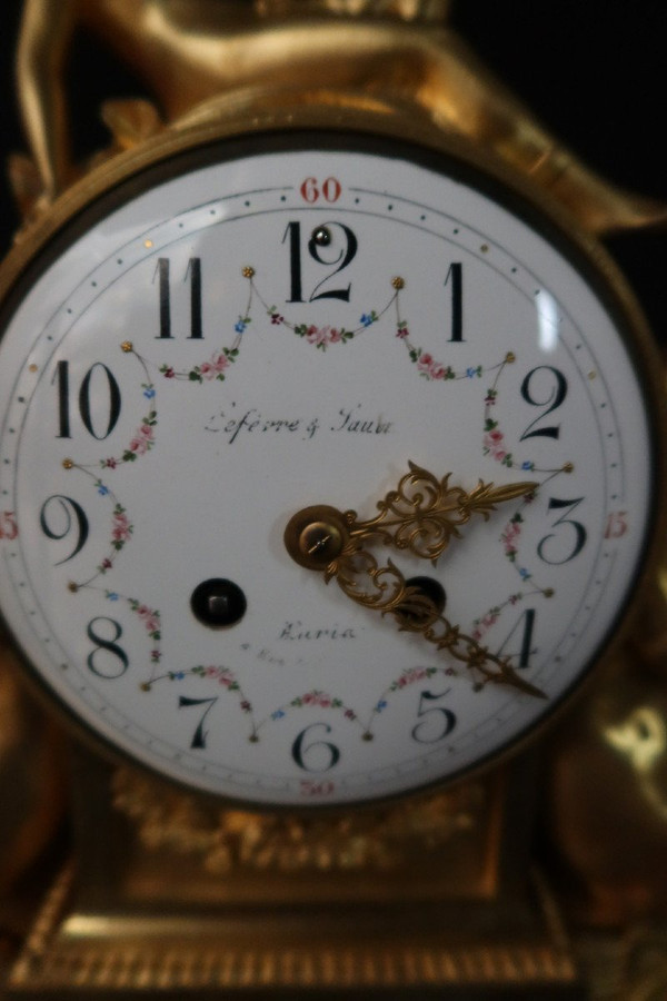 Orologio con putti musicanti in bronzo dorato XIX secolo