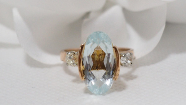 Rose Gold Ring Adorned With An Oval Aquamarine And Diamonds