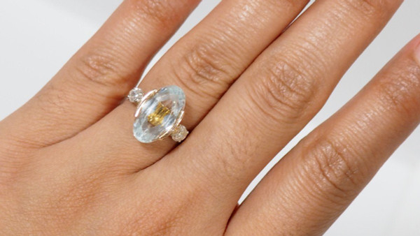 Rose Gold Ring Adorned With An Oval Aquamarine And Diamonds