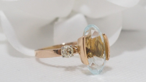 Rose Gold Ring Adorned With An Oval Aquamarine And Diamonds