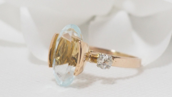 Rose Gold Ring Adorned With An Oval Aquamarine And Diamonds