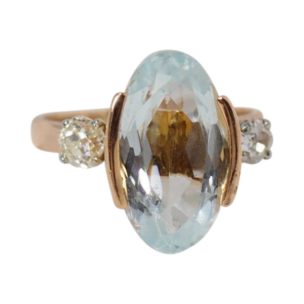 Rose Gold Ring Adorned With An Oval Aquamarine And Diamonds