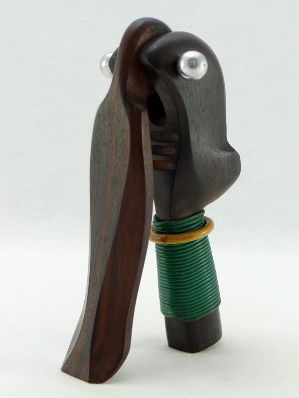 Années 1930, Période Art-Déco, Casse-noix Africaniste En ébène De Macassar, fil plastifié et verre.