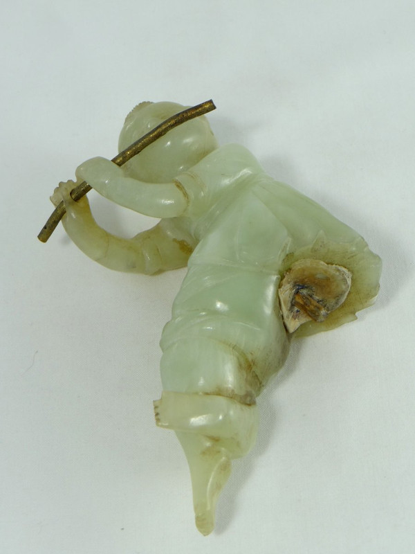 China Circa 1900, Jade Sculpture of a Child Playing the Flute.
