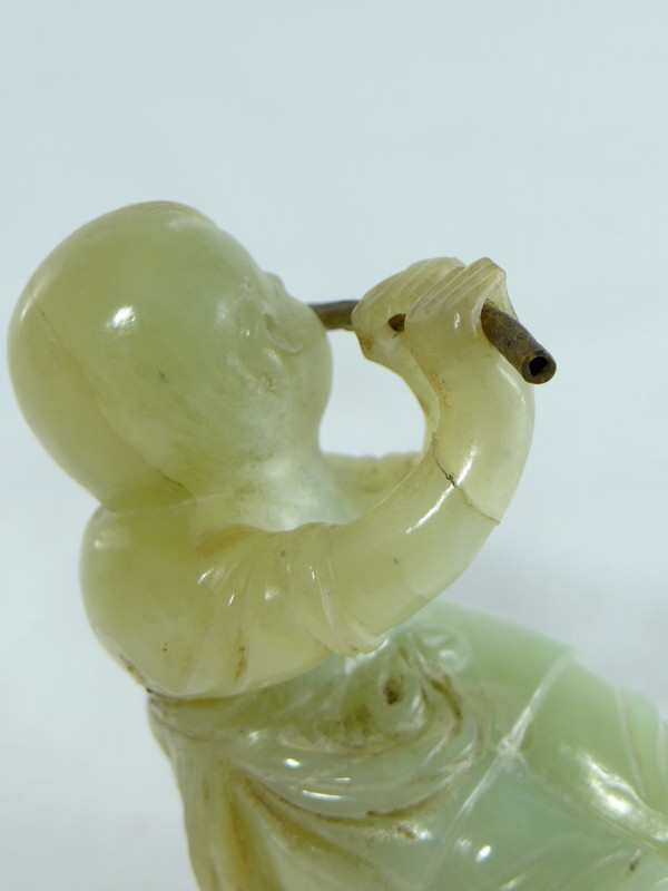China Circa 1900, Jade Sculpture of a Child Playing the Flute.