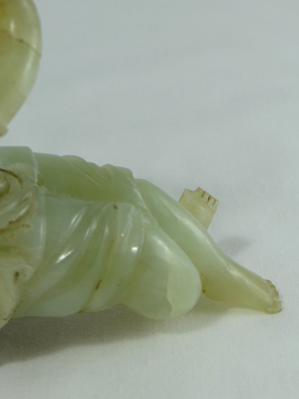 China Circa 1900, Jade Sculpture of a Child Playing the Flute.