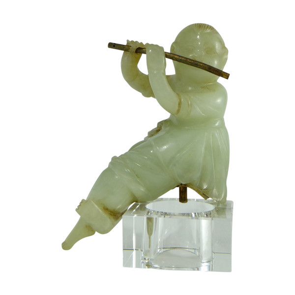 China Circa 1900, Jade Sculpture of a Child Playing the Flute.