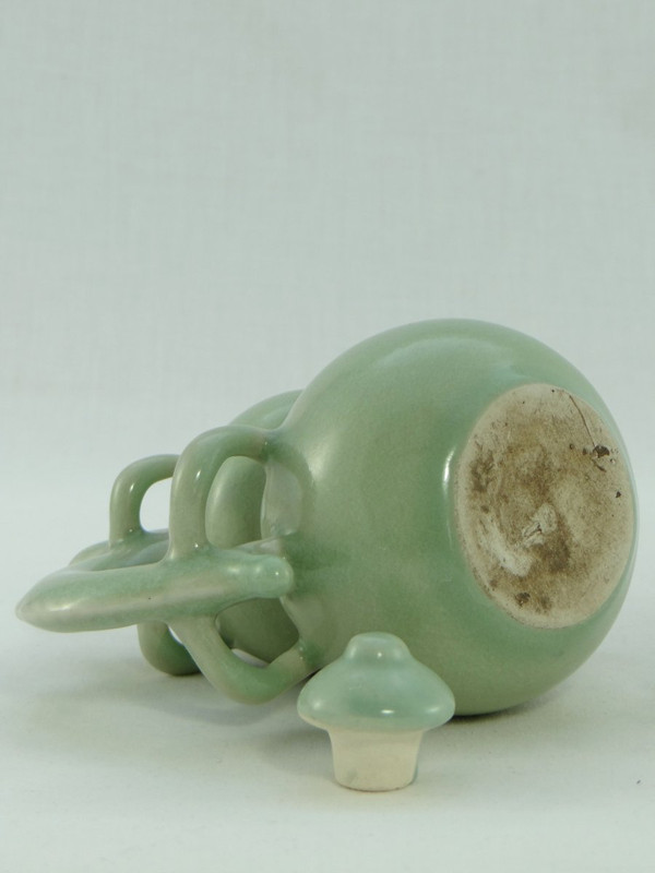 China, Mid-20th Century, Celadon porcelain teapot, two-lobed form.