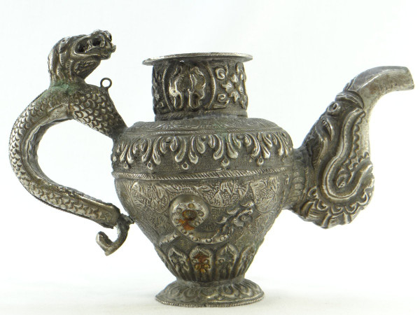 Tibet, Early 20th Century, Repoussé Silver Teapot.