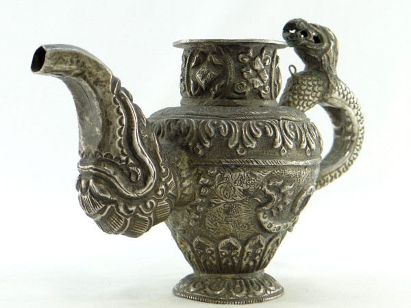 Tibet, Early 20th Century, Repoussé Silver Teapot.