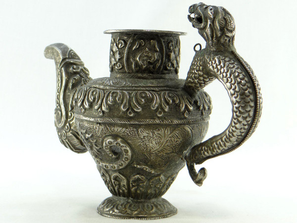 Tibet, Early 20th Century, Repoussé Silver Teapot.