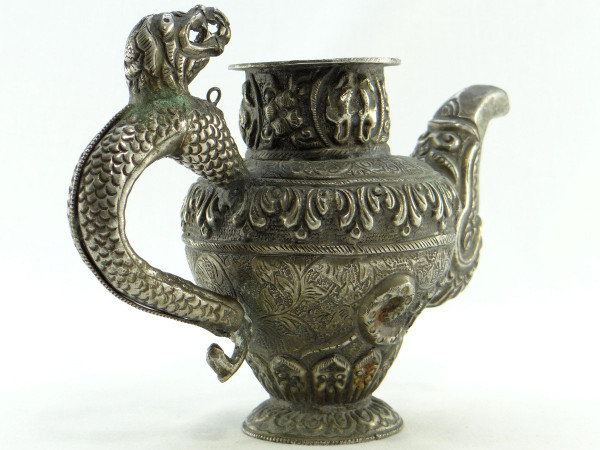 Tibet, Early 20th Century, Repoussé Silver Teapot.