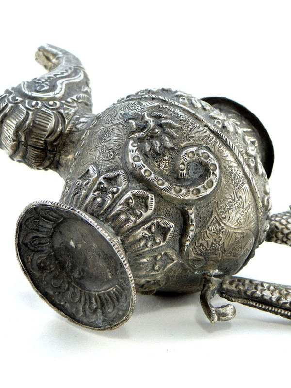 Tibet, Early 20th Century, Repoussé Silver Teapot.