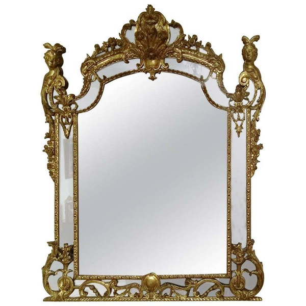 Eccezionale specchio in legno intagliato e dorato d'epoca Regence