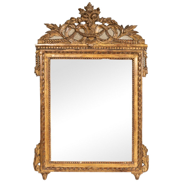 Louis XVI period carved giltwood mirror