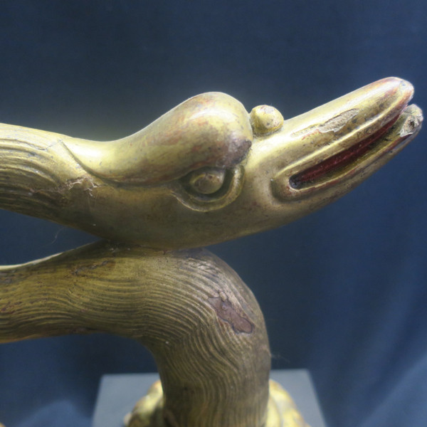Two swan heads in gilded wood