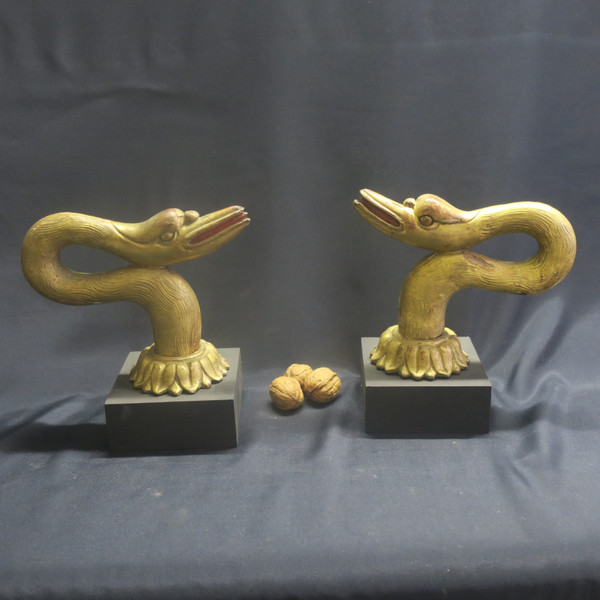 Two swan heads in gilded wood