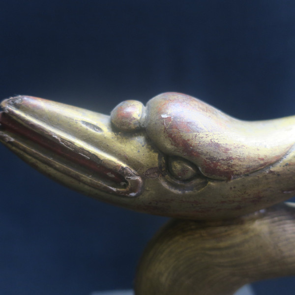 Two swan heads in gilded wood