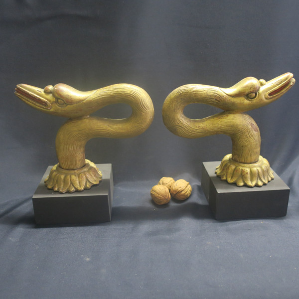 Two swan heads in gilded wood