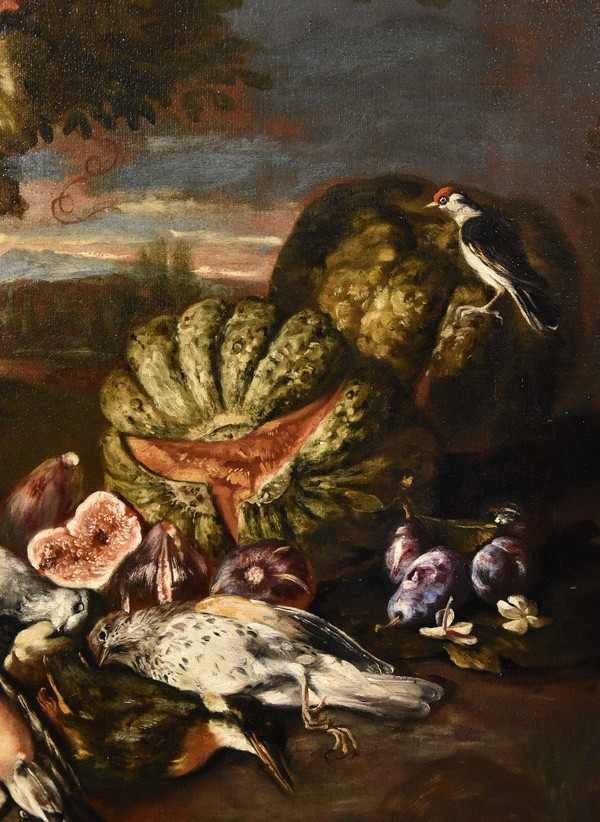 Natura morta in un paesaggio con frutta e cacciagione