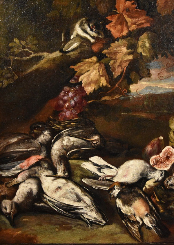 Natura morta in un paesaggio con frutta e cacciagione
