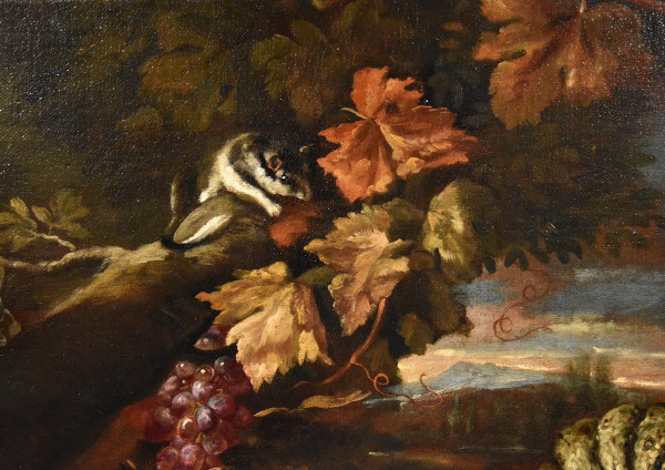 Natura morta in un paesaggio con frutta e cacciagione