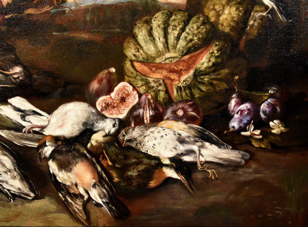 Natura morta in un paesaggio con frutta e cacciagione