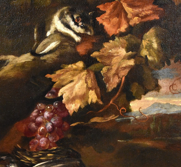 Natura morta in un paesaggio con frutta e cacciagione