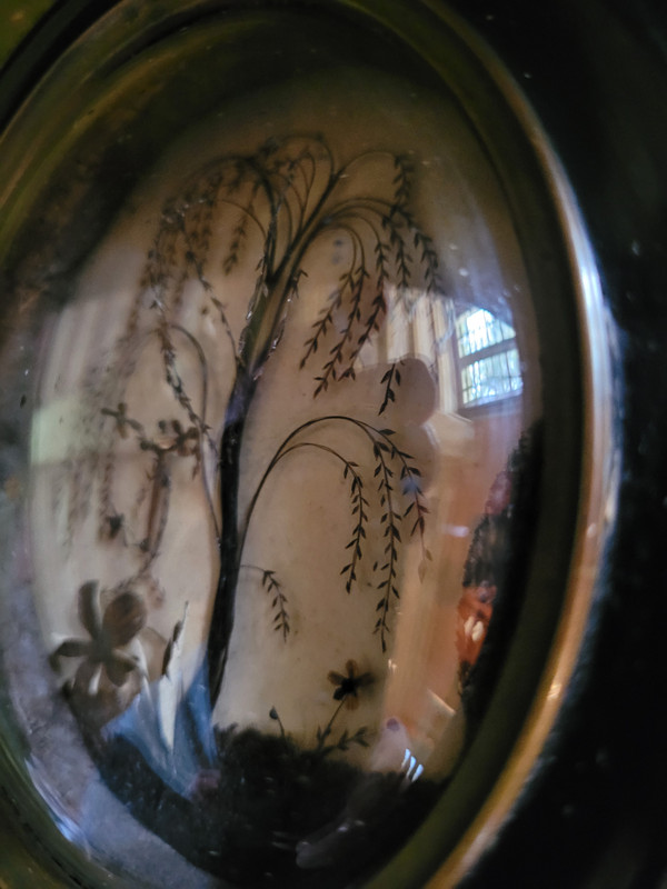 Cadre à décor en cheveux, époque XIXe siècle