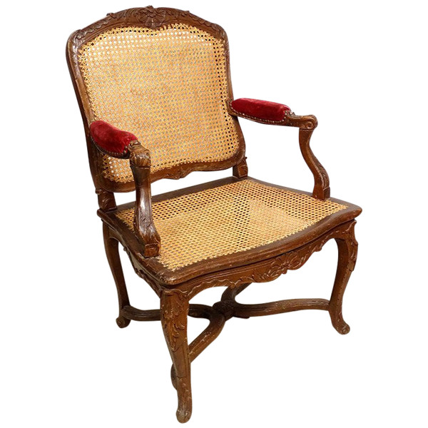Poltrona Regency in canna di faggio intagliata con conchiglie fogliate XVIII secolo
