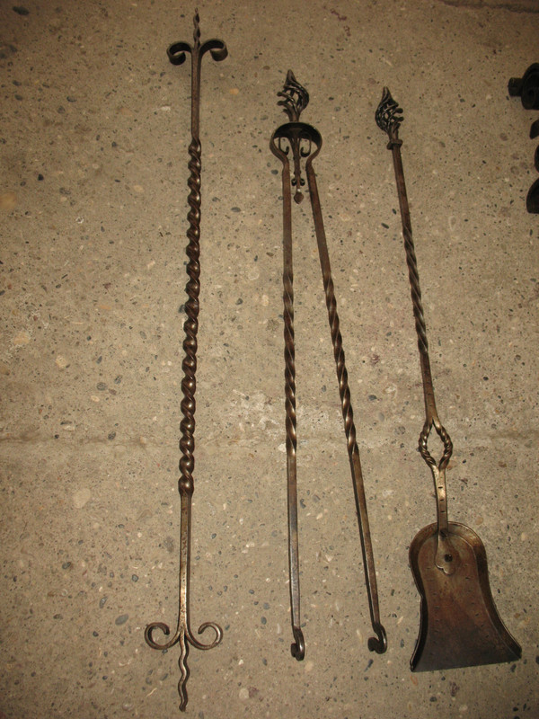 Pair of wrought-iron andirons complete with shovel, tongs and bar, 20th century