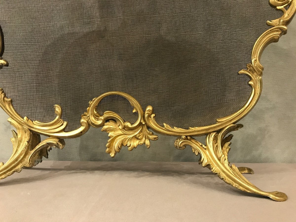 Old fireplace screen in gilded bonze from the 19th century, Louis XV style