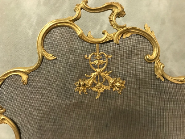 Old fireplace screen in gilded bonze from the 19th century, Louis XV style