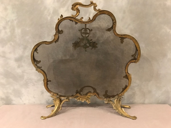 Old fireplace screen in gilded bonze from the 19th century, Louis XV style