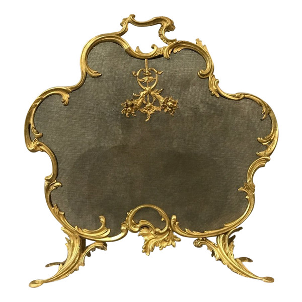 Old fireplace screen in gilded bonze from the 19th century, Louis XV style