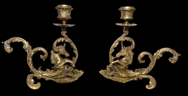 Pair of 19th century bronze candlesticks. Sea unicorns.