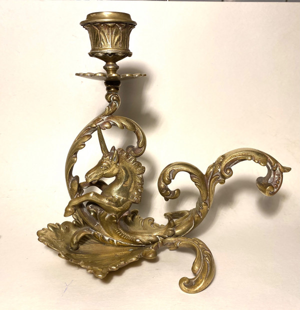 Pair of 19th century bronze candlesticks. Sea unicorns.