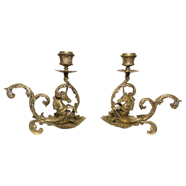 Pair of 19th century bronze candlesticks. Sea unicorns.