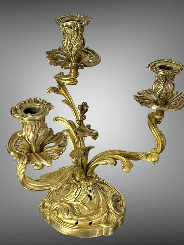PAIR OF NUMBERED THREE-BRANCH GILT BRONZE CANDLE HOLDERS IN LOUIS XV STYLE