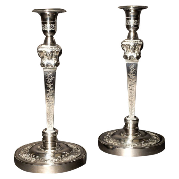 Pair of candlesticks in solid silver, with the count's coat of arms, by Denis Garreau