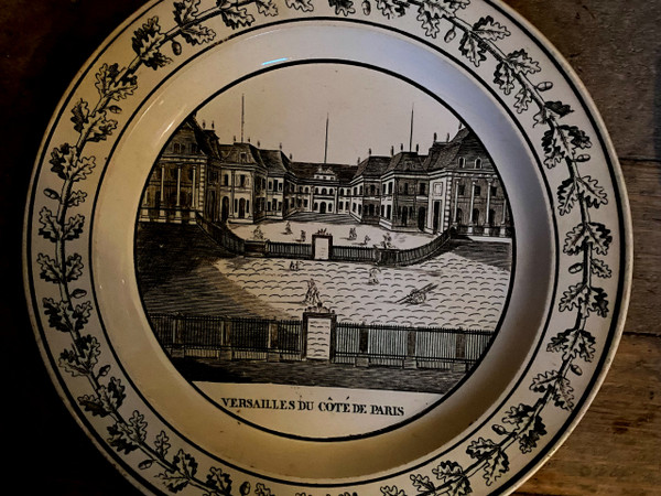  Suite of 4 Choisy earthenware plates representing monuments of Paris and Versailles 19th