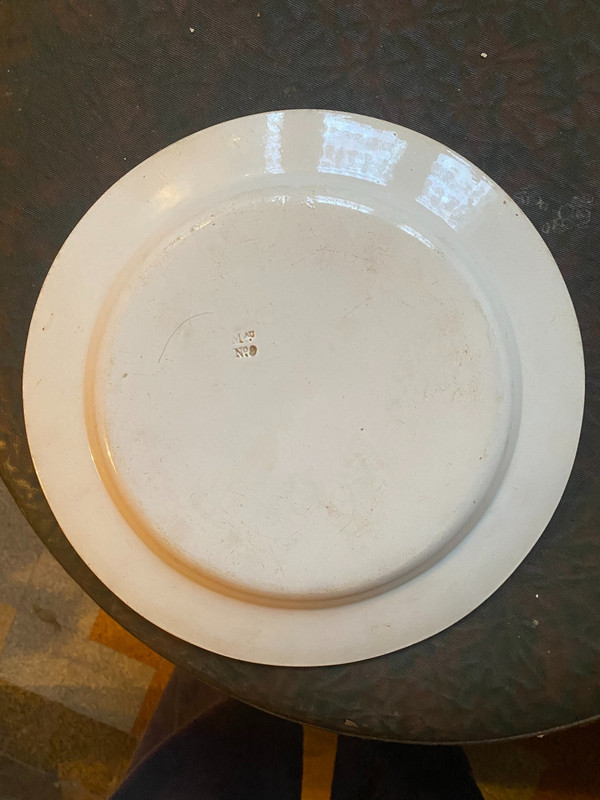  Suite of 4 Choisy earthenware plates representing monuments of Paris and Versailles 19th