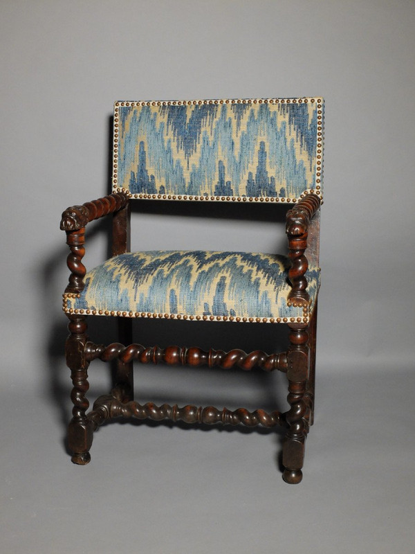 Louis XIII period armchair with lion's muzzles