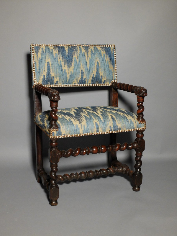 Louis XIII period armchair with lion's muzzles
